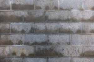 water-damaged brick-shaped stucco
