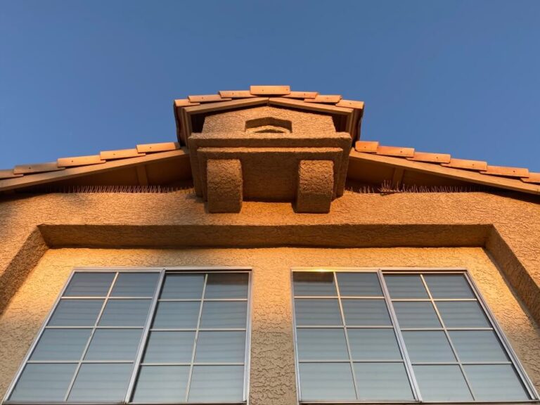 part of house with beige stucco