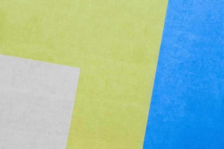 image of wall with white green and blue stucco