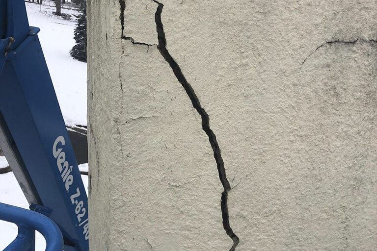 image of a wall with cracked stucco