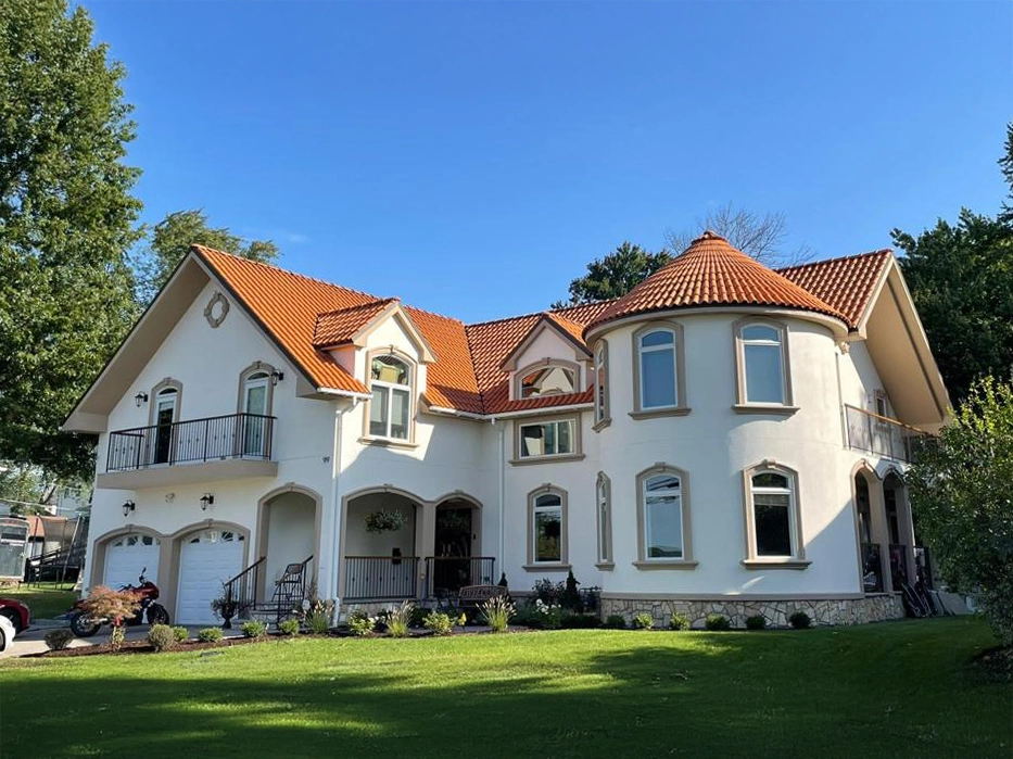 Stucco Repair and Installation in Teaneck, NJ 6 stucco home terracotta tile roof turret
