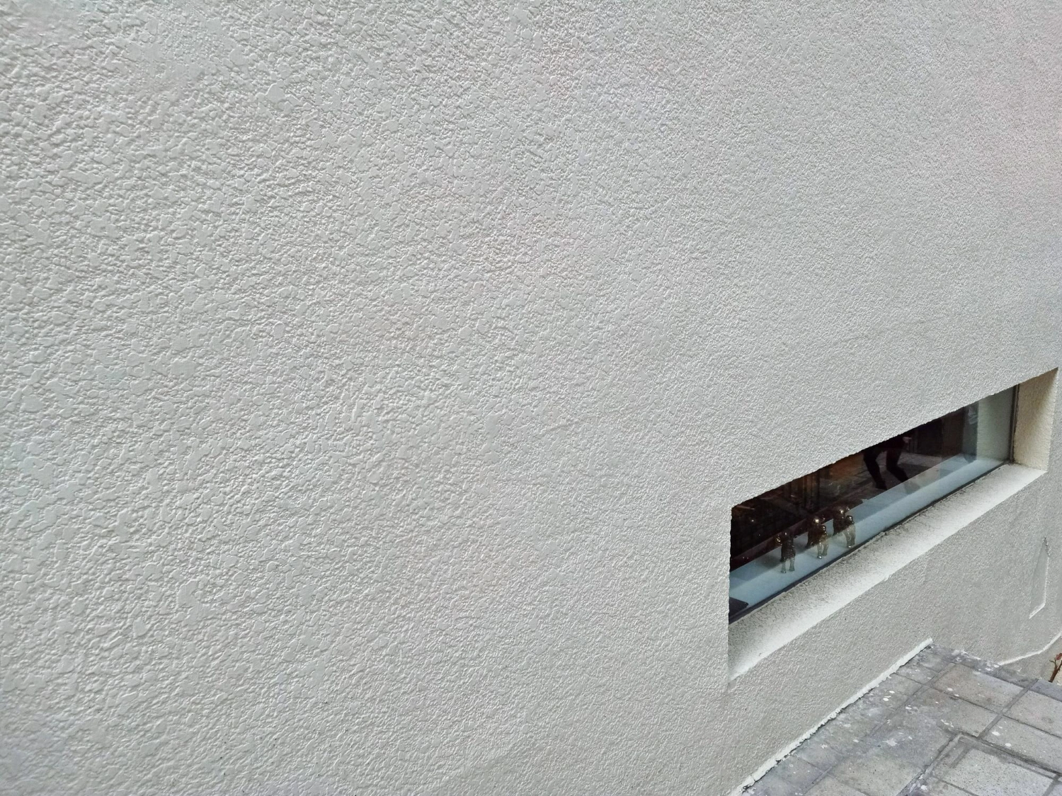 Refreshed stucco wall with uniform texture and crisp window reveal by ZD Stucco Repair