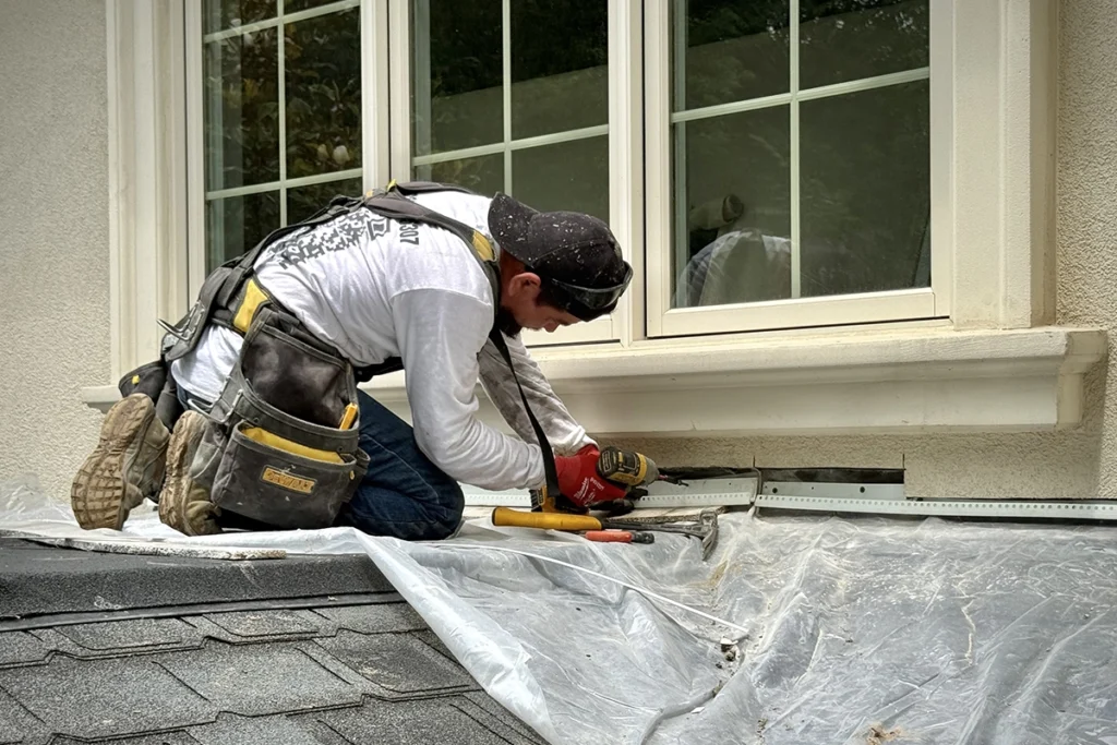 Window flashing and water-management work during exterior wall repair