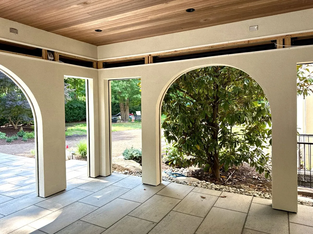 Demarest NJ 4 Close-up of arched stucco detailing around a patio opening