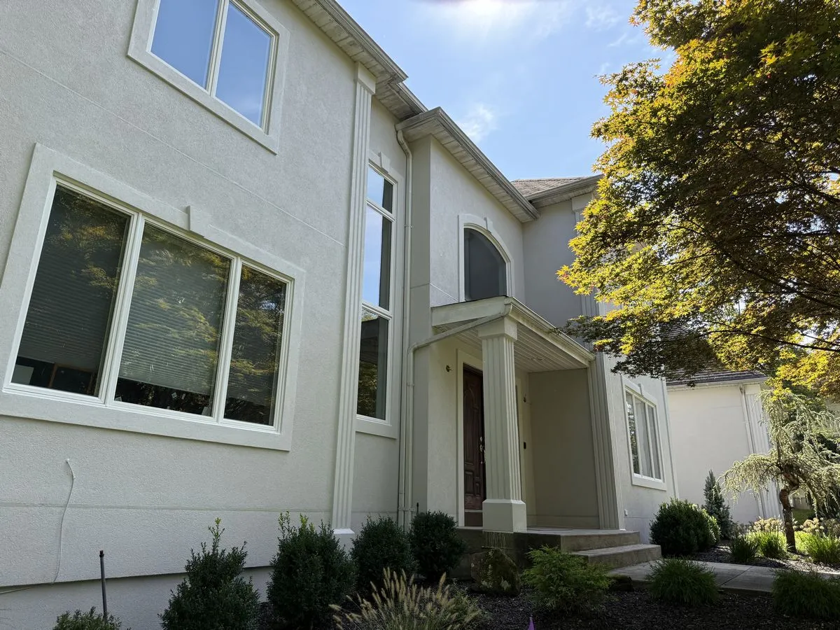 Suffern NY 3 Applying two coats of elastomeric coating to the stucco
