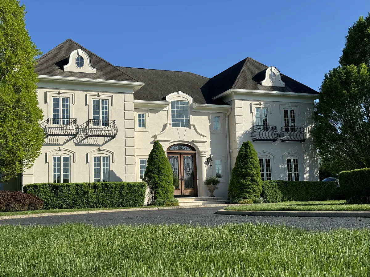 Reinforcing the mansion's structure behind stucco walls