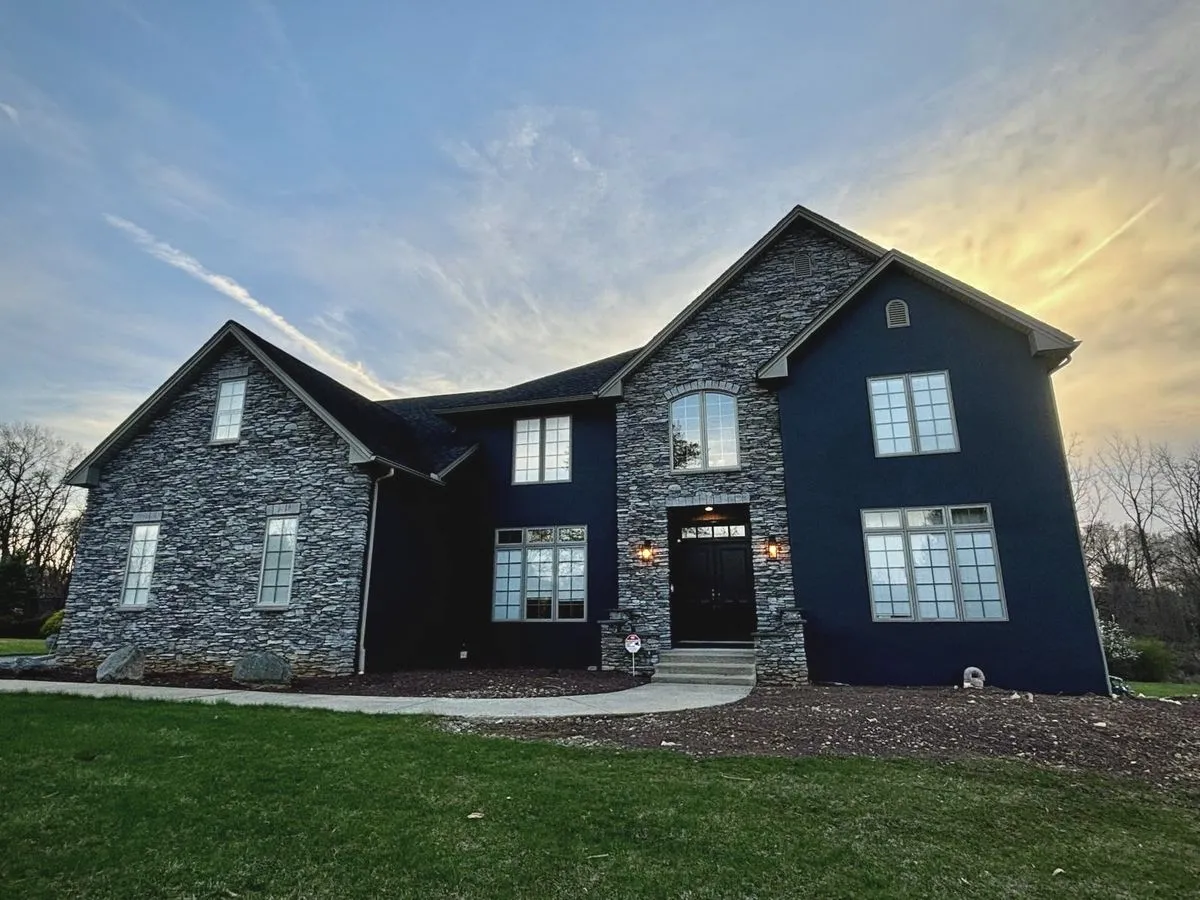 Transformed stucco exterior after comprehensive restoration