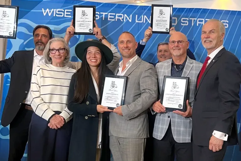Zoltan Dicso and fellow business leaders holding WISE East US 2025 awards at the Roundtable event