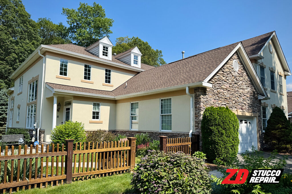 Stucco and Stone Exterior: 15 Ideas for Modern and Traditional Homes 8 Front view of Chester, NJ home with repaired stucco, stone accents and fresh elastomeric coating by ZD Stucco Repair