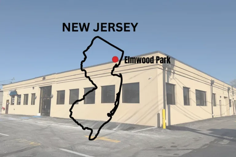 New Jersey map highlighting Elmwood Park with ZD Stucco Repair office building in the background.