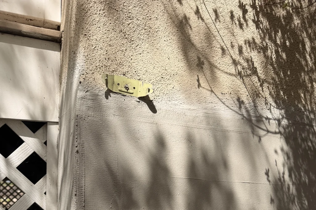 How to Match Stucco Texture During Repair So Your Exterior Looks Seamless 4 Exterior stucco repair patch showing texture preparation near a window in NJ