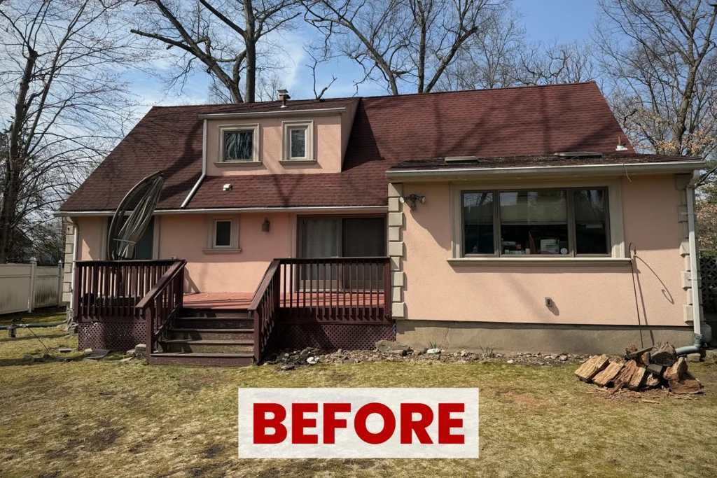 Before photo of worn stucco exterior with staining and aging before restoration