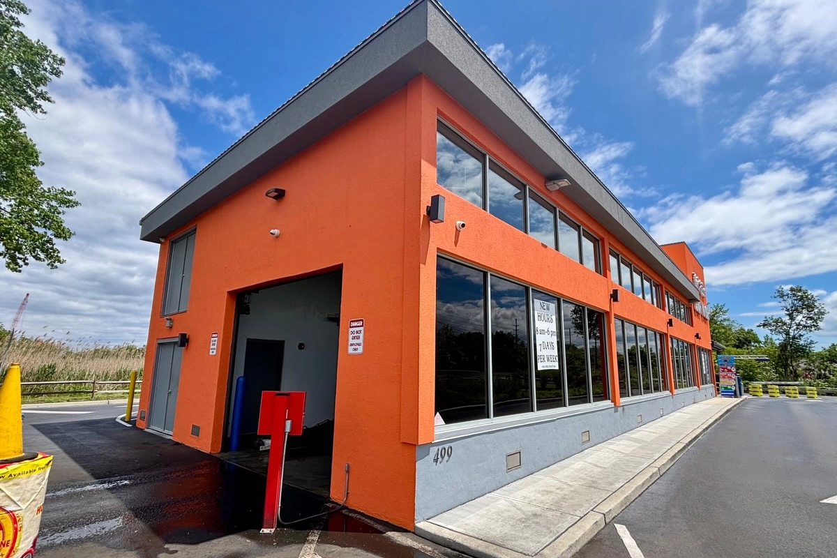 Completed commercial stucco exterior at Wet Side Car Wash, Port Monmouth NJ – two-coat Dryvit elastomeric paint applied by ZD Stucco Repair