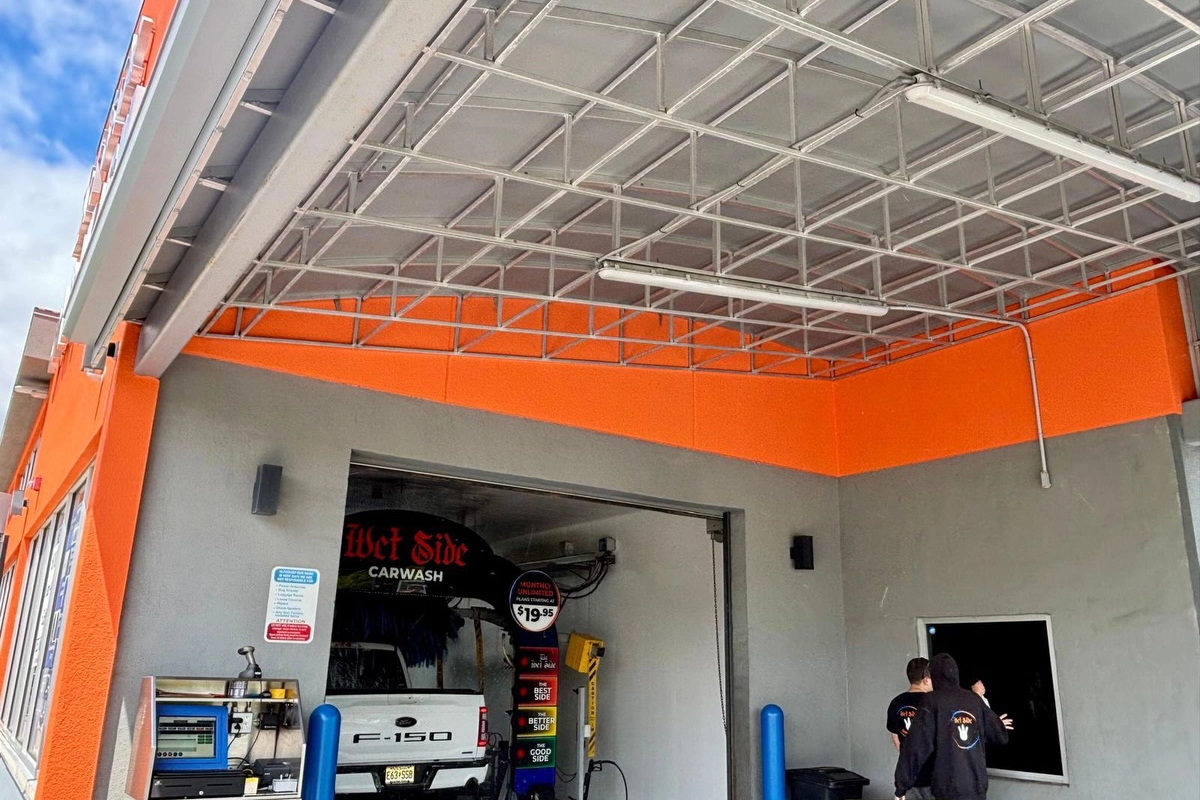 Interior entry canopy area at Wet Side Car Wash showing freshly painted orange stucco walls – commercial stucco painting by ZD Stucco Repair, Port Monmouth NJ