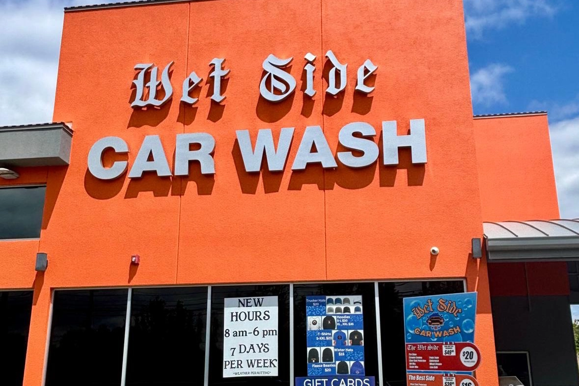 Orange stucco facade with Wet Side Car Wash signage after exterior painting by ZD Stucco Repair, Port Monmouth NJ