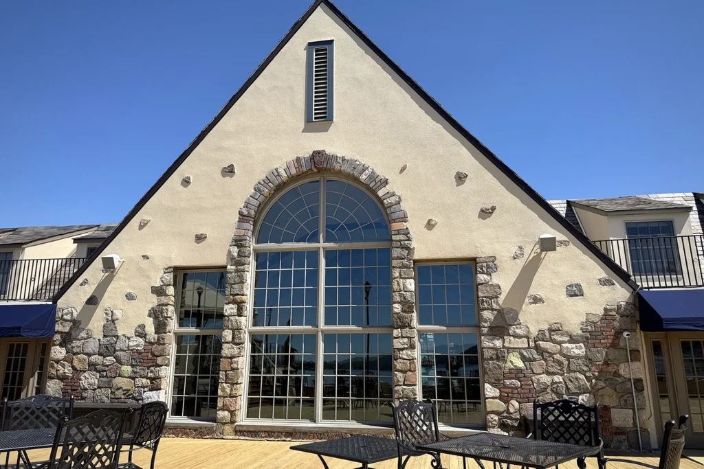 How We Restored a Historic 1930 Castle to Its Original Glory: Lake Mohawk Country Club Stucco Restoration 7 Stone and stucco facade of Lake Mohawk Country Club after exterior restoration and preservation work