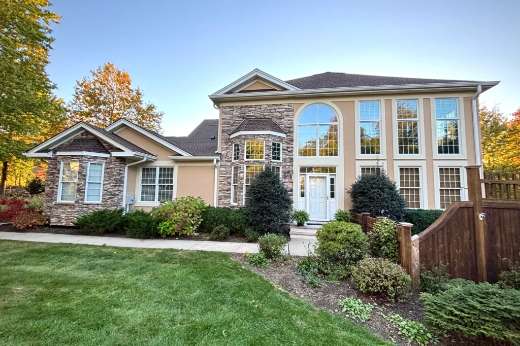 Restored stucco and stone exterior at the Four Seasons community in Chester, NJ, after coating and sealing.