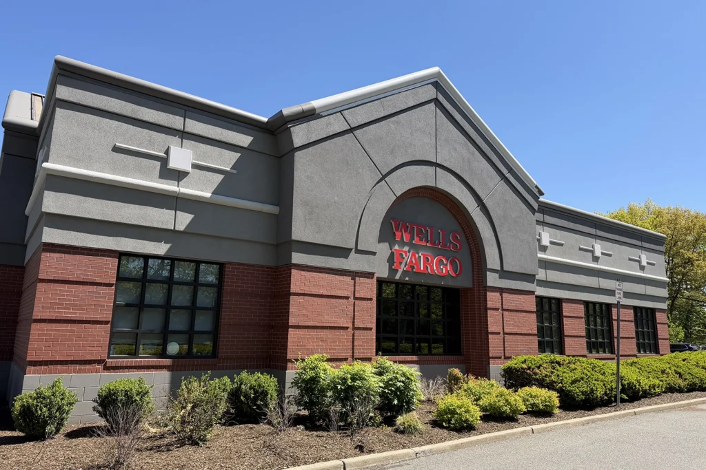 EIFS Synthetic Stucco Problems & Solutions in New Jersey 9 Fully restored commercial stucco facade on Wells Fargo building featuring pristine gray and red stucco with proper flashing, color matching, and architectural details preserved