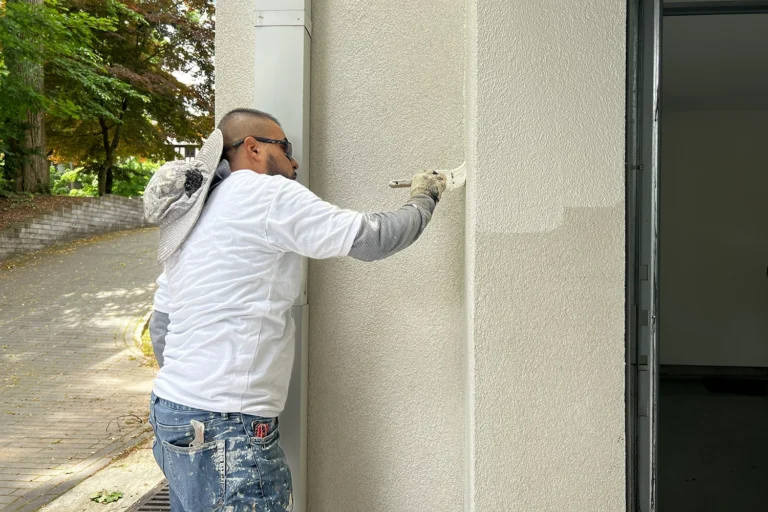 Contractor matching texture and color after exterior wall repair