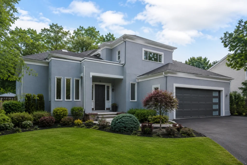 15 Gray Stucco House Ideas: Light, Dark, White Trim & Black Accents 10 blue gray stucco house white trim