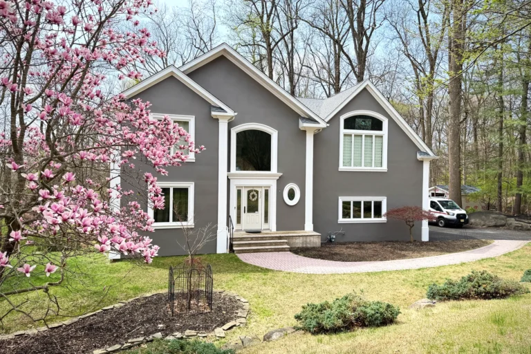 Restored front exterior with landscaping at Franklin Lakes residence in Franklin Lakes, NJ.