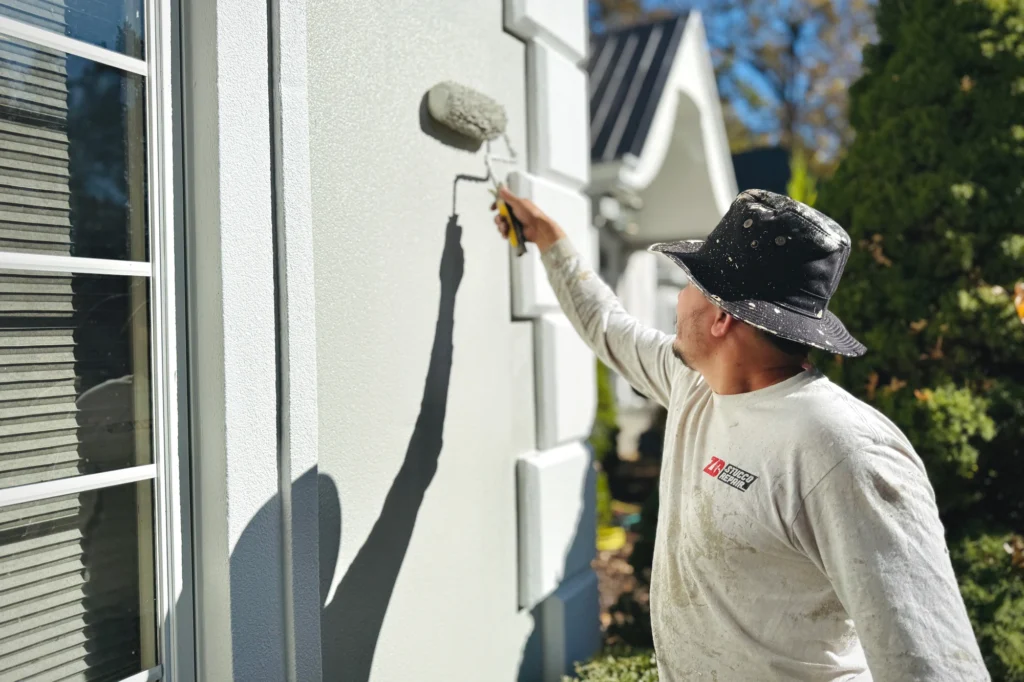15 Gray Stucco House Ideas: Light, Dark, White Trim & Black Accents 18 Exterior coating application process at Saddle River residence in Saddle River, NJ.