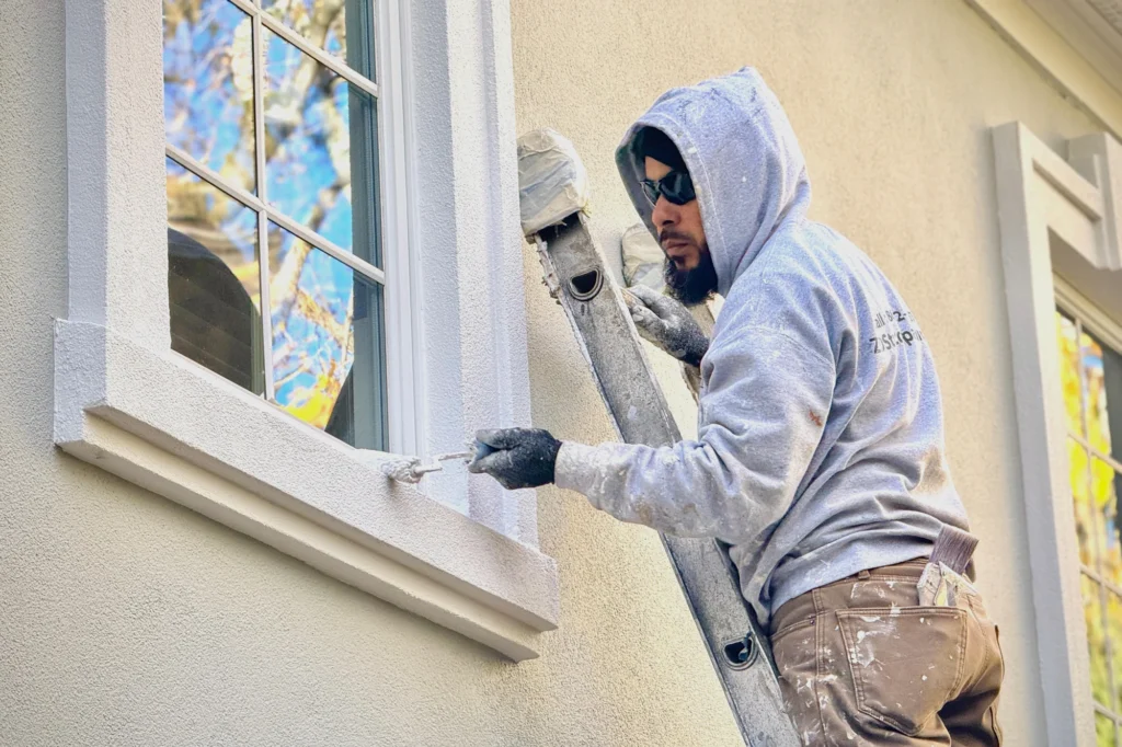 Window trim sealing process at Saddle River residence in Saddle River, NJ.
