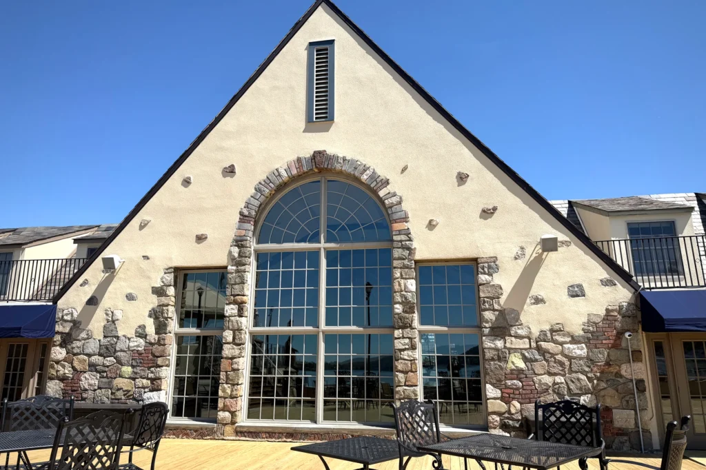 Stucco and Stone Exterior: 15 Ideas for Modern and Traditional Homes 18 Exterior project view of Lake Mohawk Country Club Historic Exterior Restoration in Sparta, NJ.