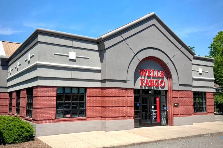 Restored Wells Fargo front entrance with finished gray EIFS facade and brick exterior